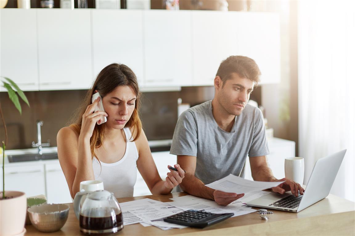 Couple sorting out their finances - Credit: Freepik